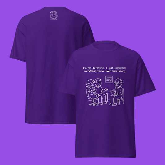 Funny men's sarcastic relationship drama humor novelty tee, casual streetwear  graphic t-shirt showing the front and back view, featuring a couples therapy session line art illustration. Perfect as a sarcastic couples joke or funny gift for friends, with the quote: "I'm not defensive. I just remember everything you've ever done wrong."
