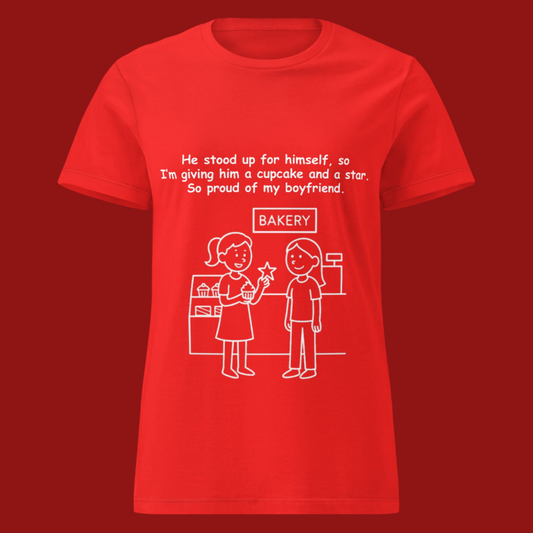 Funny women's sarcastic relationship humor novelty tee, casual streetwear  graphic t-shirt featuring a woman holding a cupcake reward in a bakery line art illustration. Perfect as a funny boyfriend roast joke or sarcastic couple gift for friends, with the quote: "He stood up for himself, so I'm giving him a cupcake and a star. So proud of my boyfriend."